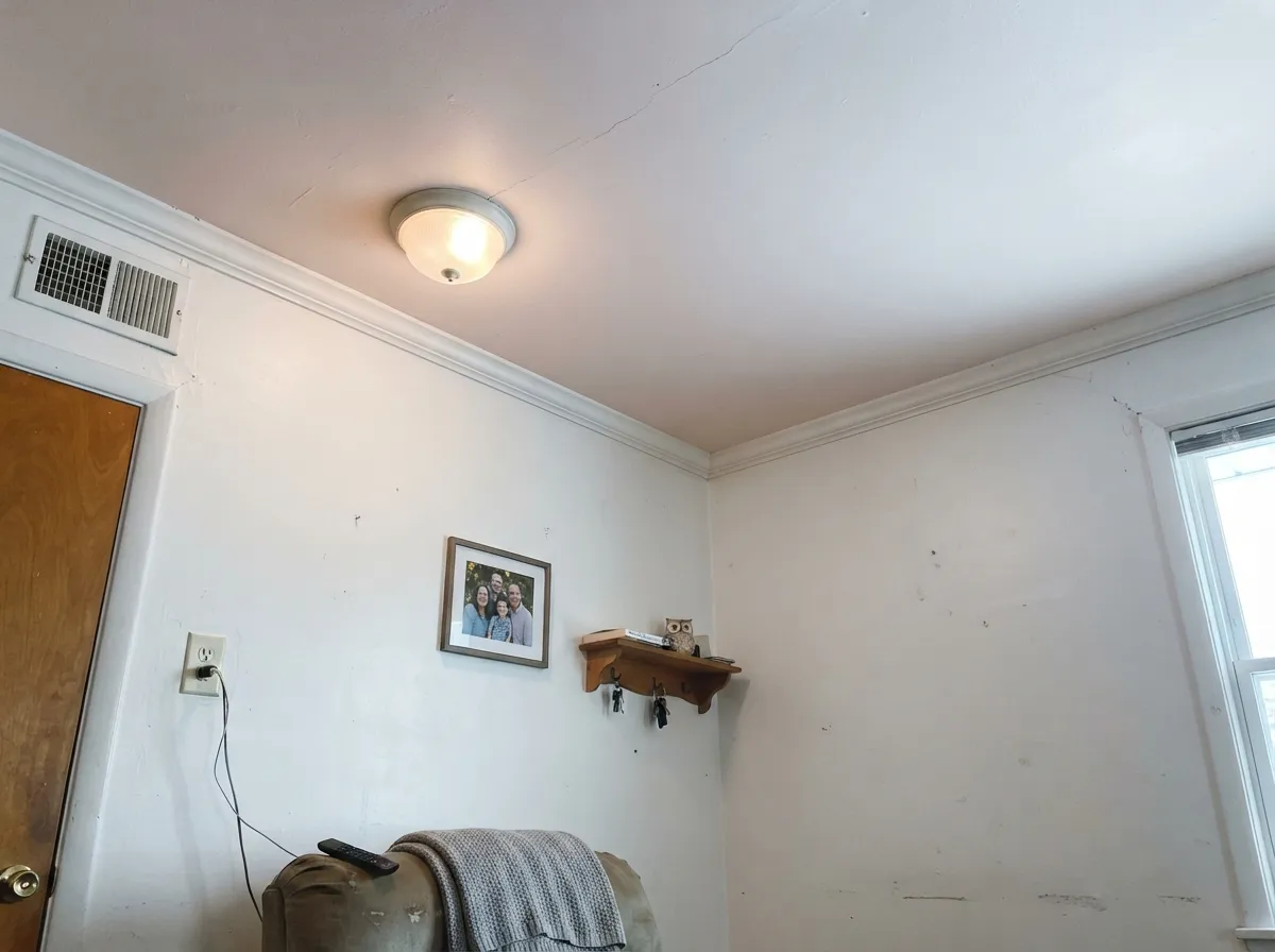 The fifth-wall trick: painted only overhead under white walls, the blush is barely-there but unmistakably warmer than plain white.