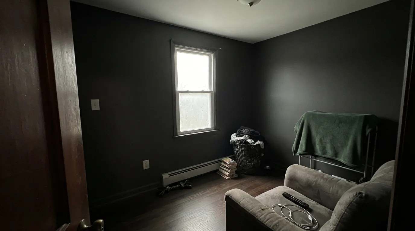 The honest shot: a small room with weak daylight and no lamps on. Broadway doesn't go moody here, it just goes dark — the exact situation behind the "felt like a cave" complaints.