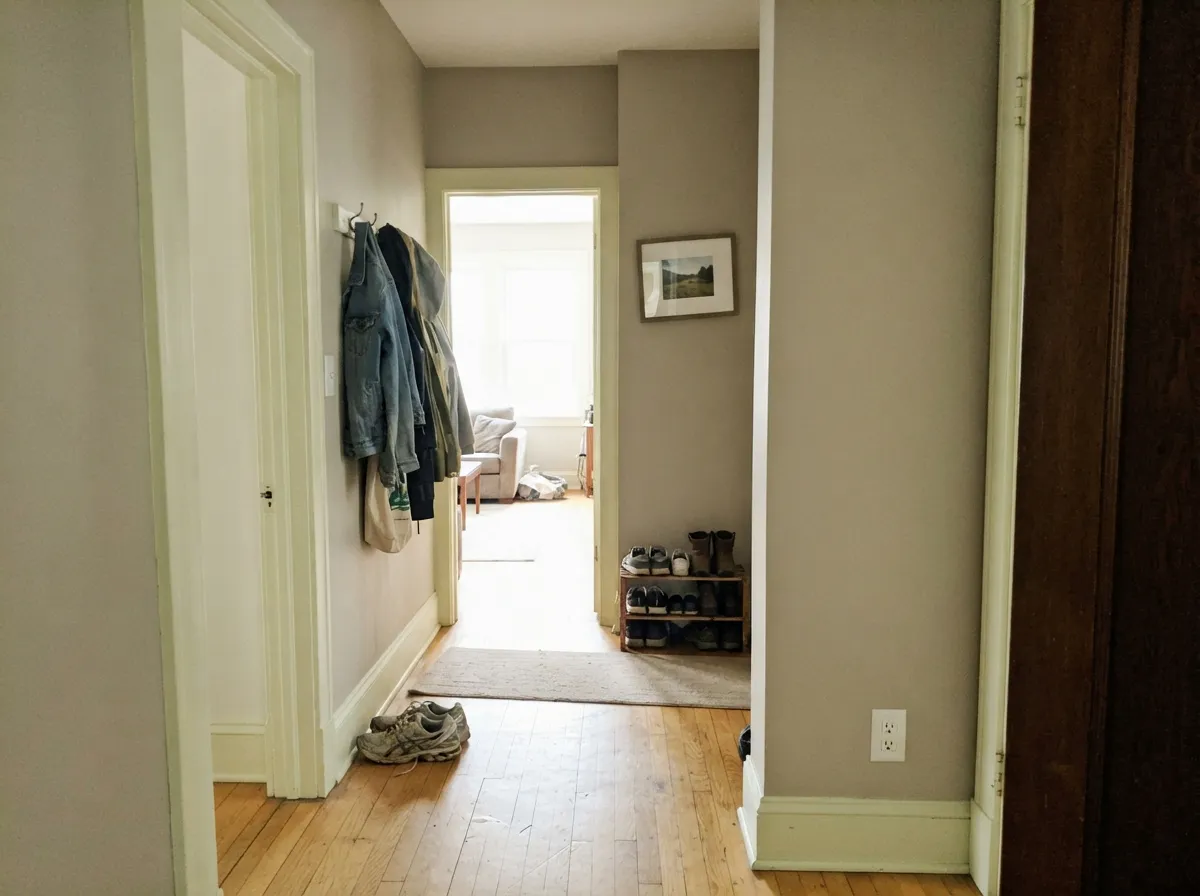 The pairing job: Falling Snow millwork on Gratifying Gray walls — contrast without a brighter white making the greige look dirty.