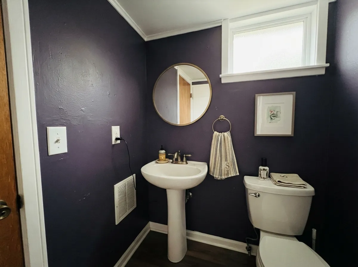 Small rooms take the full-strength color well — with a bright white ceiling and trim, it reads custom, not closed-in.