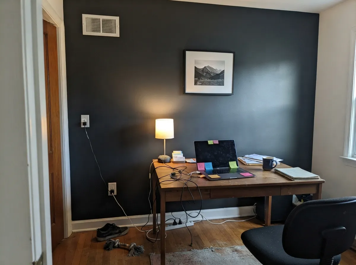 With a window feeding it real light, the accent wall reads sharp and grounded instead of just dark.