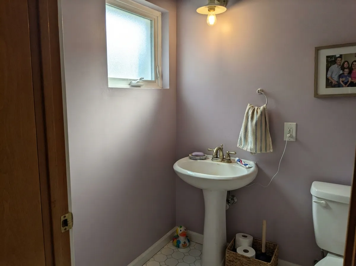 One navy nook keeps a full-wall playroom from reading as all pastel — the combination that lets the room grow up with the kid.