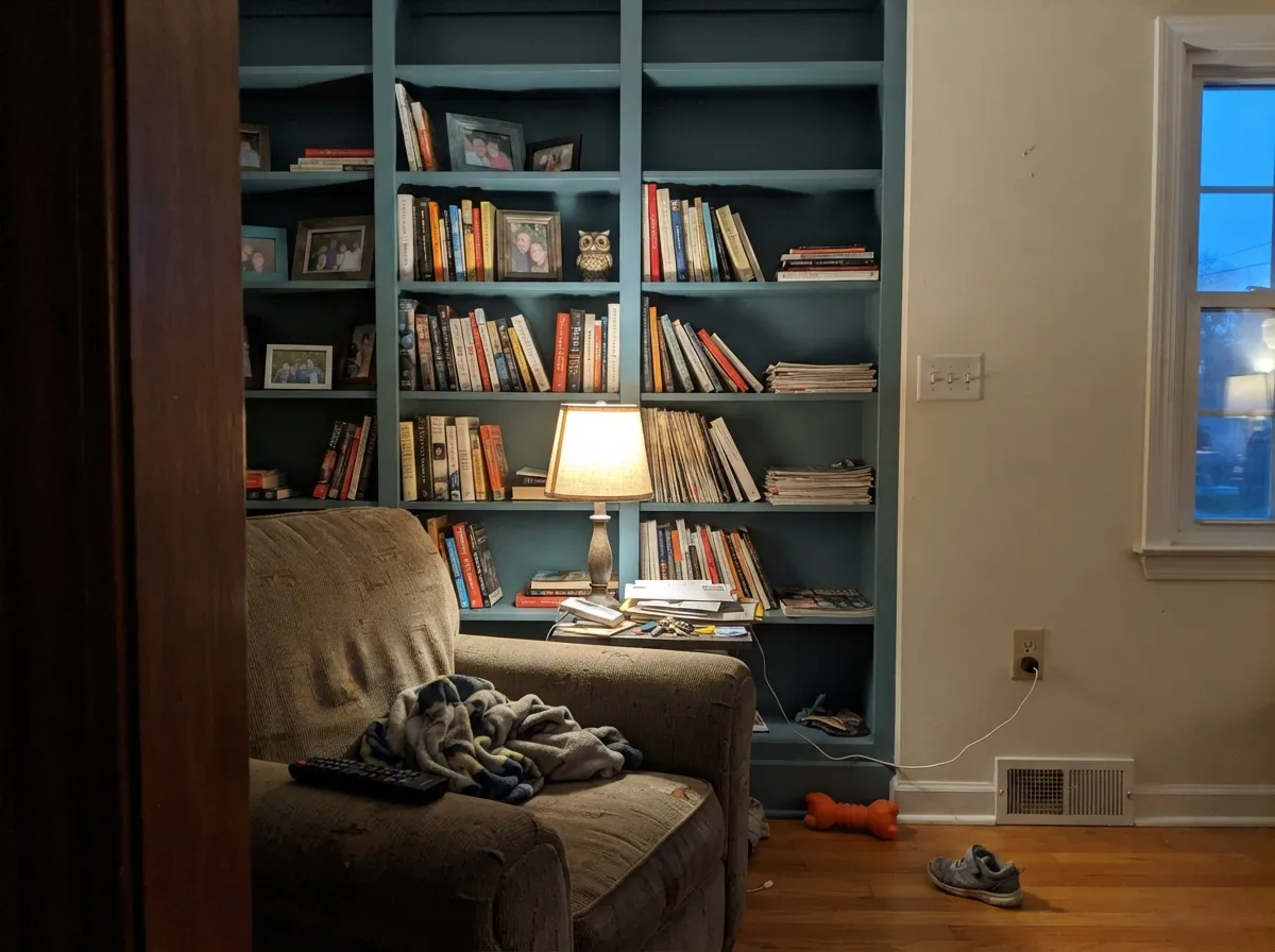 Built-ins are the color's third home — one warm lamp nearby brings out the brown undertone Behr's own description promises.