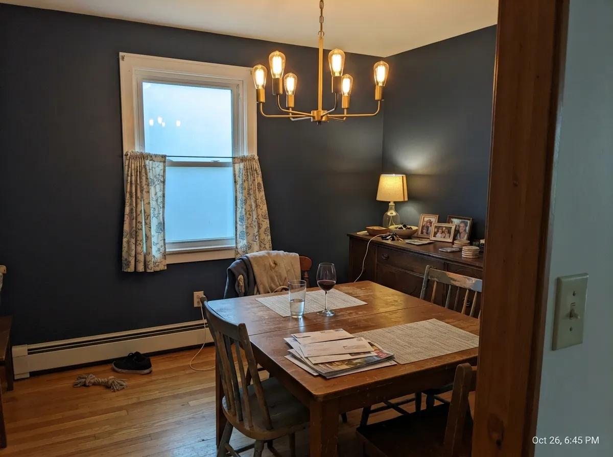 In a lamplit dining room the color goes rich and cozy — exactly the evening use it's built for.