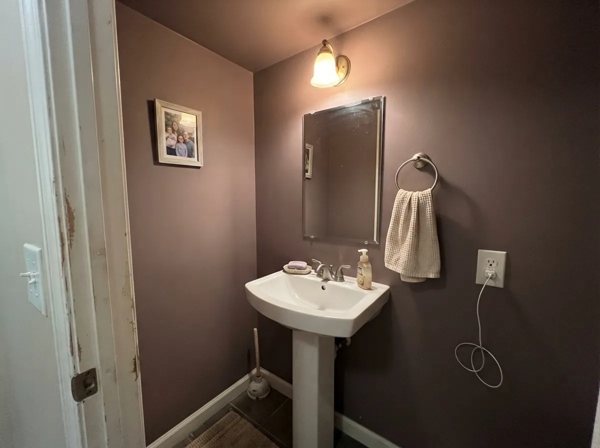 Cinnamon Slate on powder room walls and ceiling with a white vanity.