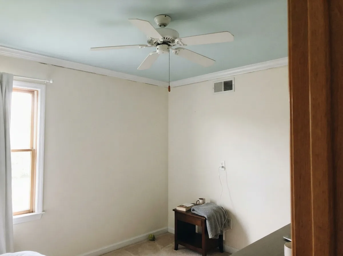 The quiet ceiling trick: Glacier Blue overhead against warmer walls adds a whisper of color without lowering the room.