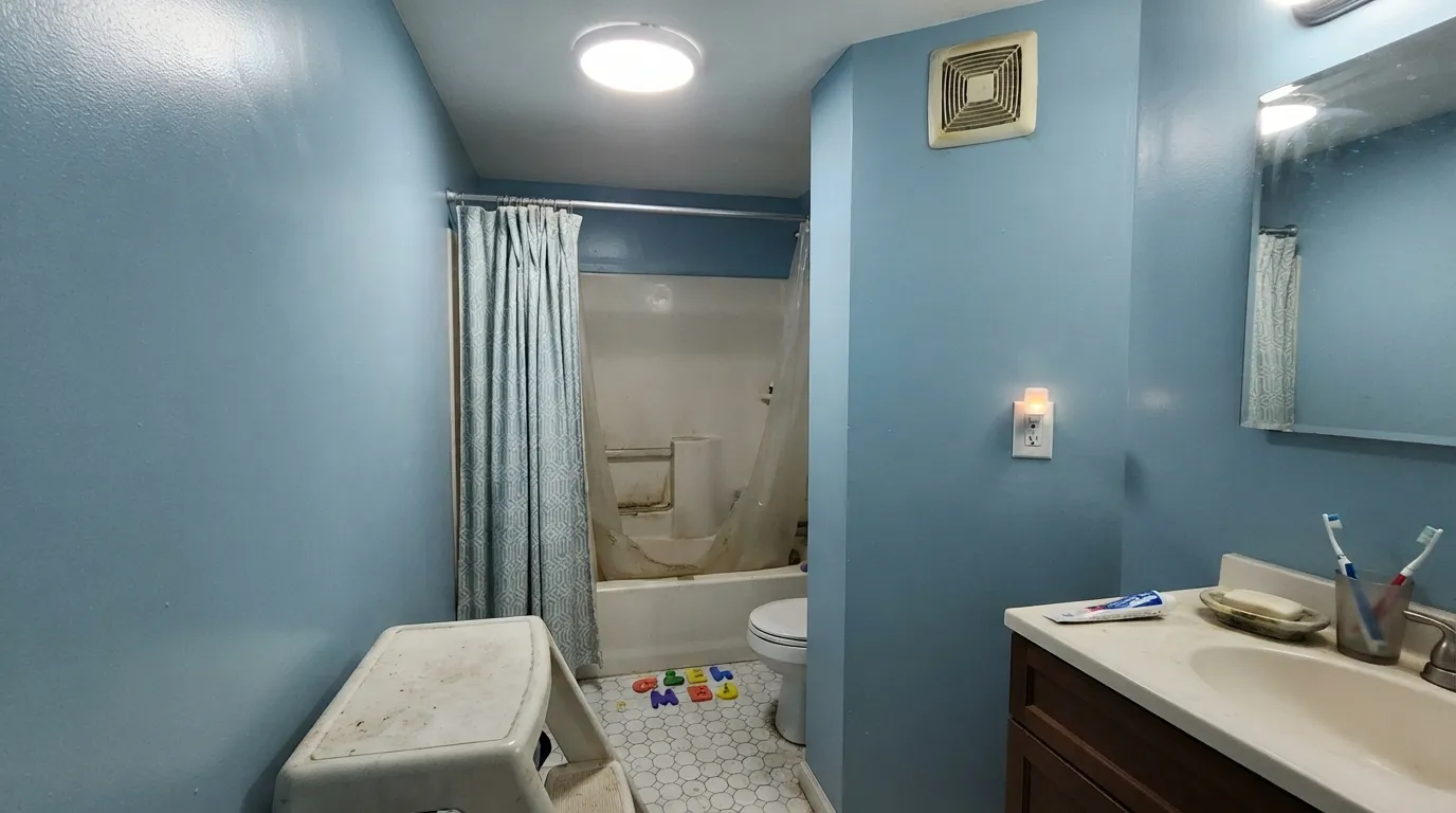 The honest shot: cool LED light with no daylight strips the warmth out entirely — this is the room where Honolulu Blue stops feeling cheerful and starts feeling clinical.