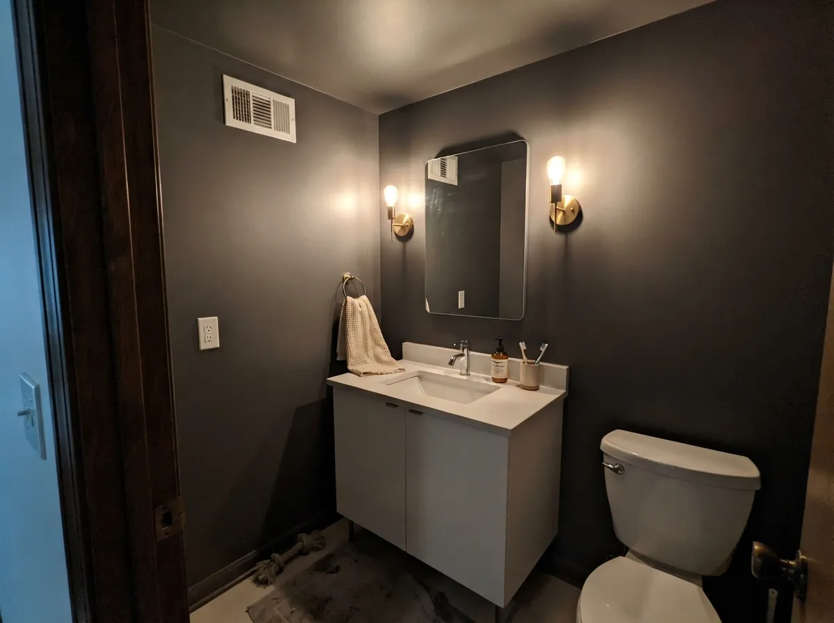 Kendall Charcoal on powder room walls and ceiling with a bright white vanity.