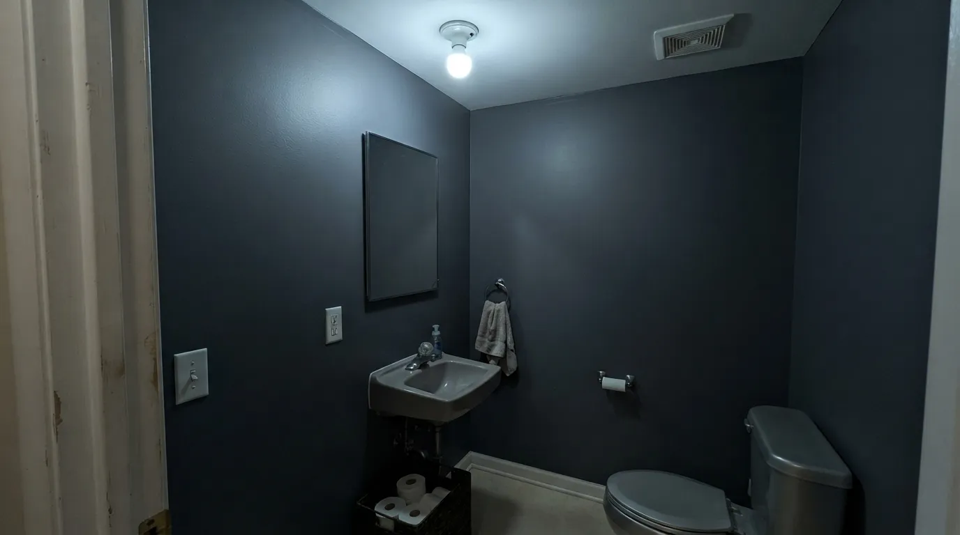 The honest shot: no daylight, no warm bulb, and the blue simply disappears — this is the light Kensington Blue cannot survive.
