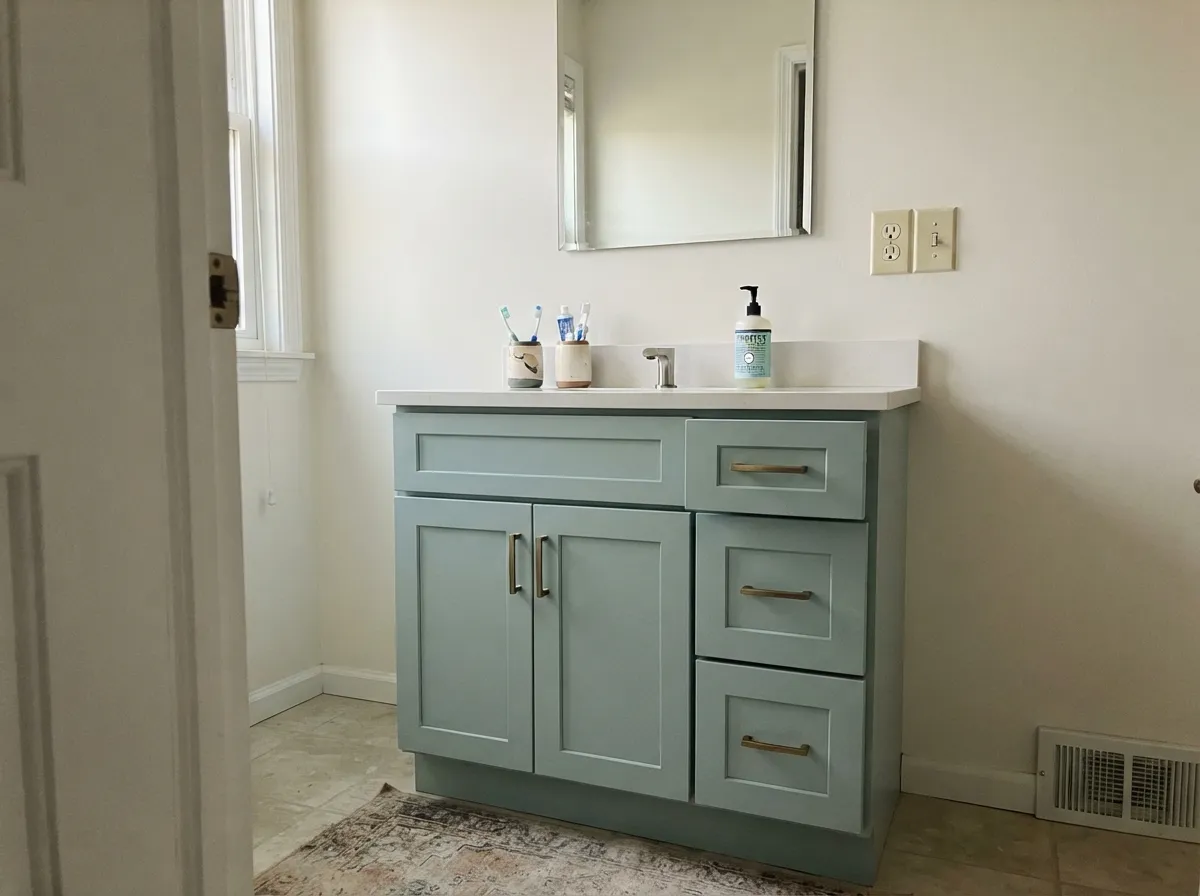 On a single vanity against white quartz it is at its best — colored enough to look chosen, soft enough not to shout.