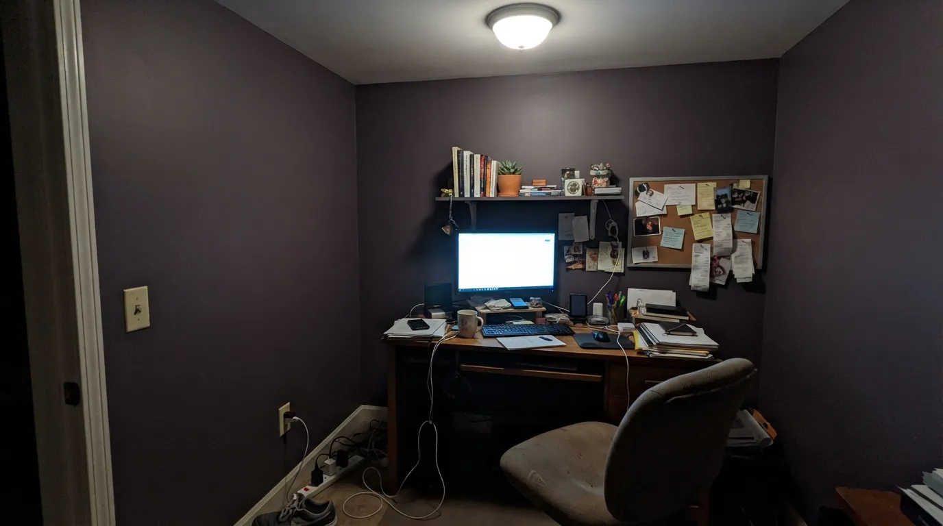 The honest shot: one cool 4000K fixture in a north room and the warm brown disappears — the wall goes plum-gray, which is the complaint people post most.