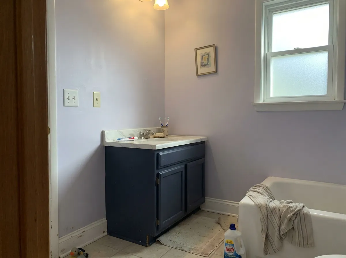 With cool stone and a Hale Navy vanity, Winter Gray reads spa-cool and expensive — its best pairing outside the bedroom.