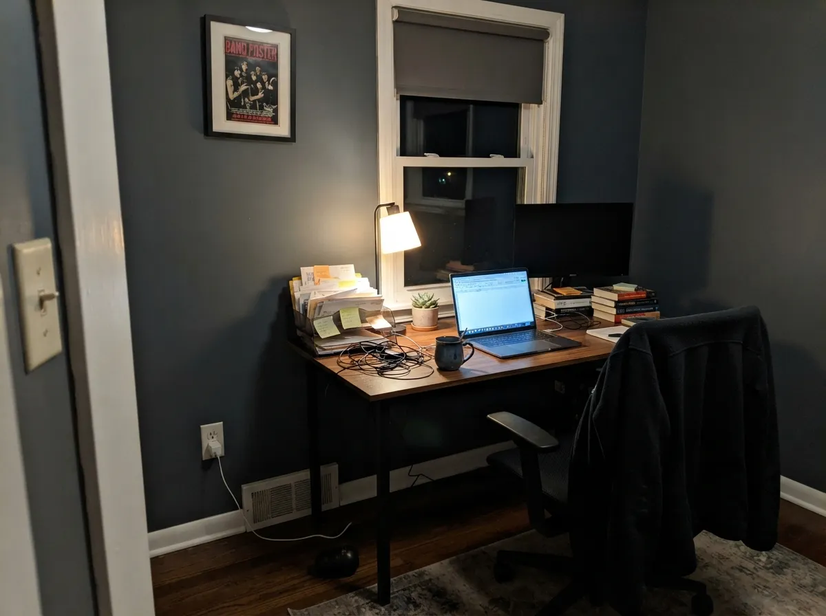 A lamplit office is this color's second home — the midnight holds as blue when the desk lamp is doing the work.