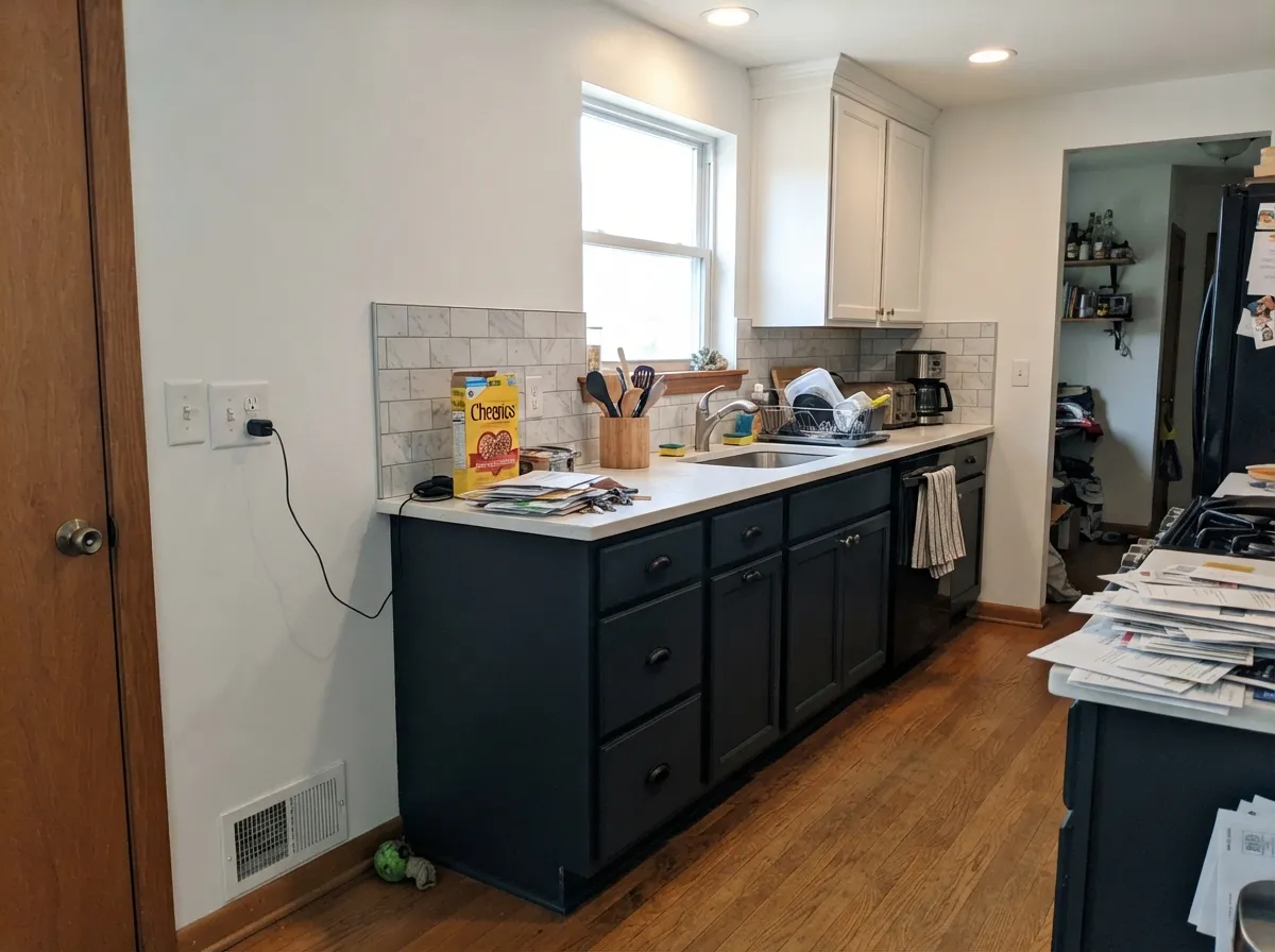 High-contrast cabinets: Dark Engine in satin under Pure White walls — sharp, wipeable, and still charcoal rather than piano-black.