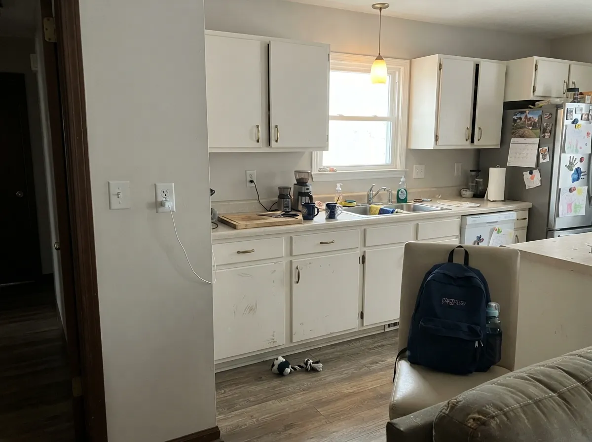 Fossil as the kitchen field with Warm White boxes — a grayed-white backdrop that stays clean against brass and pale stone.