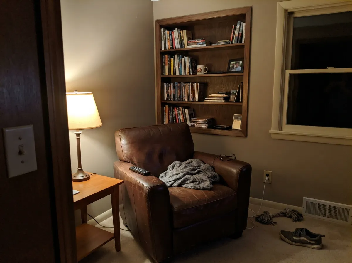 Under 2700K lamps the brown comes forward and the den goes nutwood-cozy — the interior case for Hickory if the room actually has lamps.