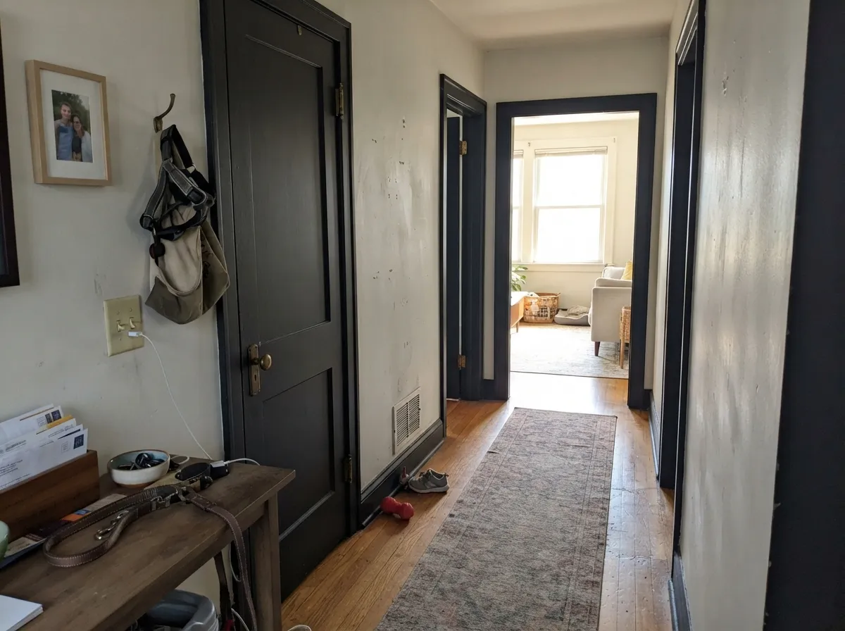 Black Magic interior doors and trim against light hallway walls.