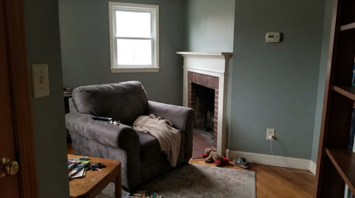 The honest shot: in cool north light with no lamps on, the warmth drains out and Evergreen Fog goes muddy gray — the exact complaint people post.