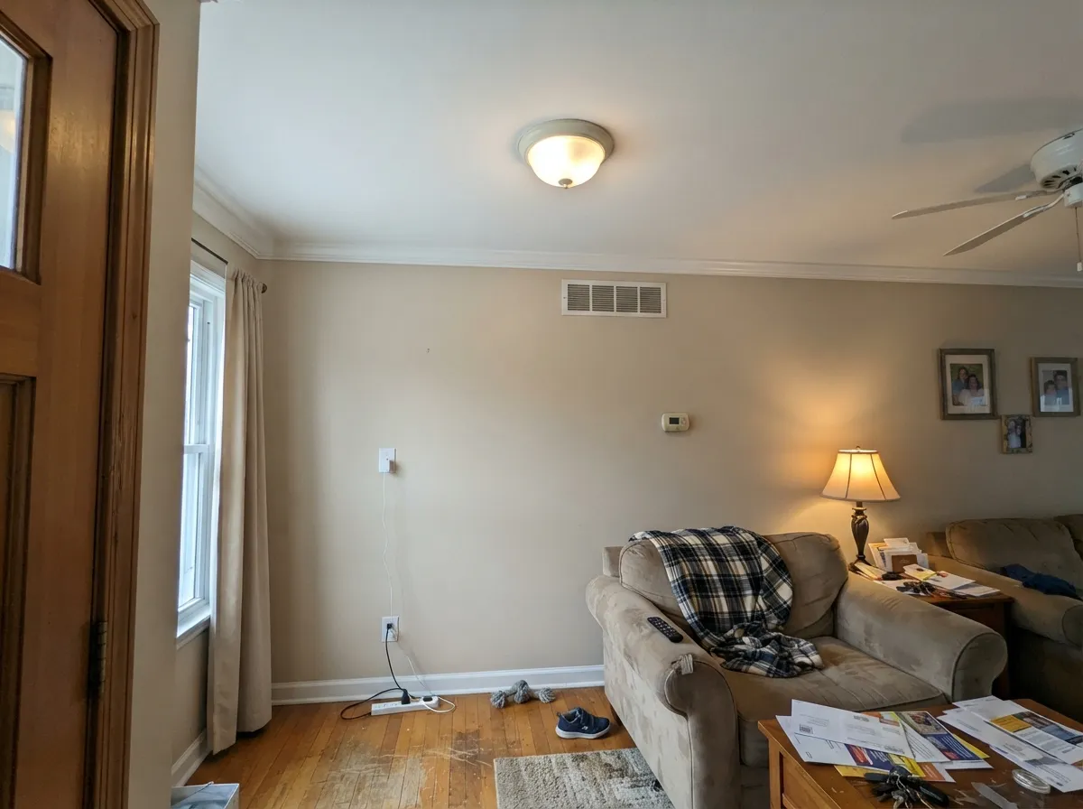 Extra White flat ceiling brightening a room with warm-toned walls below.