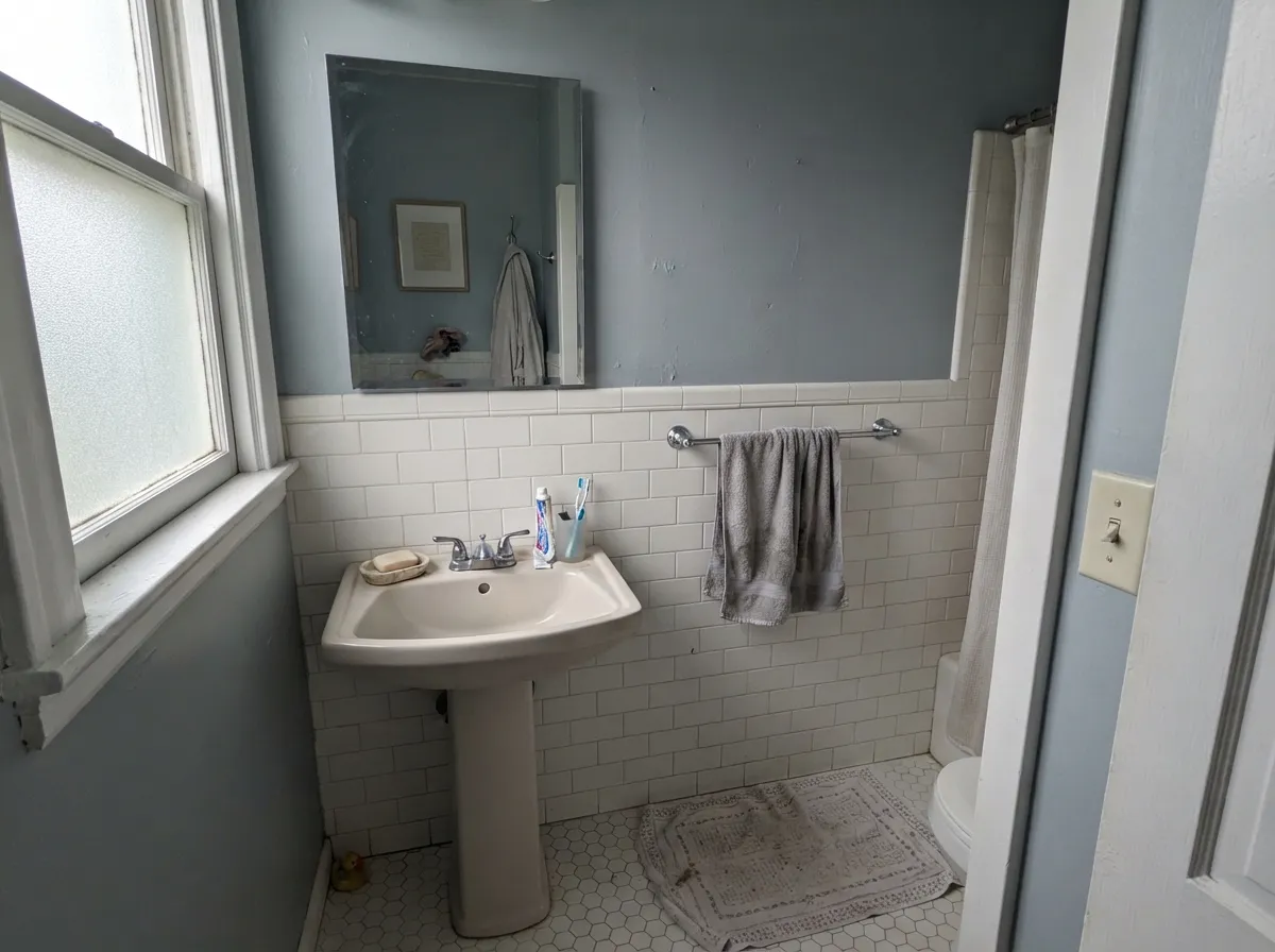 Its other best room: with white tile and chrome fixtures, Passive reads like a spa color, not a cold one.