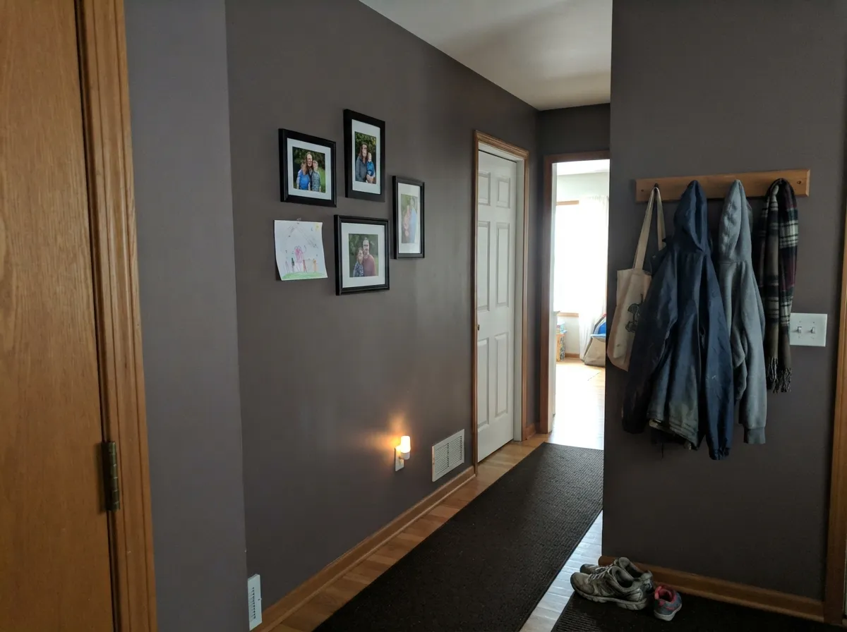 One of the two rooms Sherwin-Williams itself recommends it for — hallways carry the depth without the risk of one big sunlit wall.