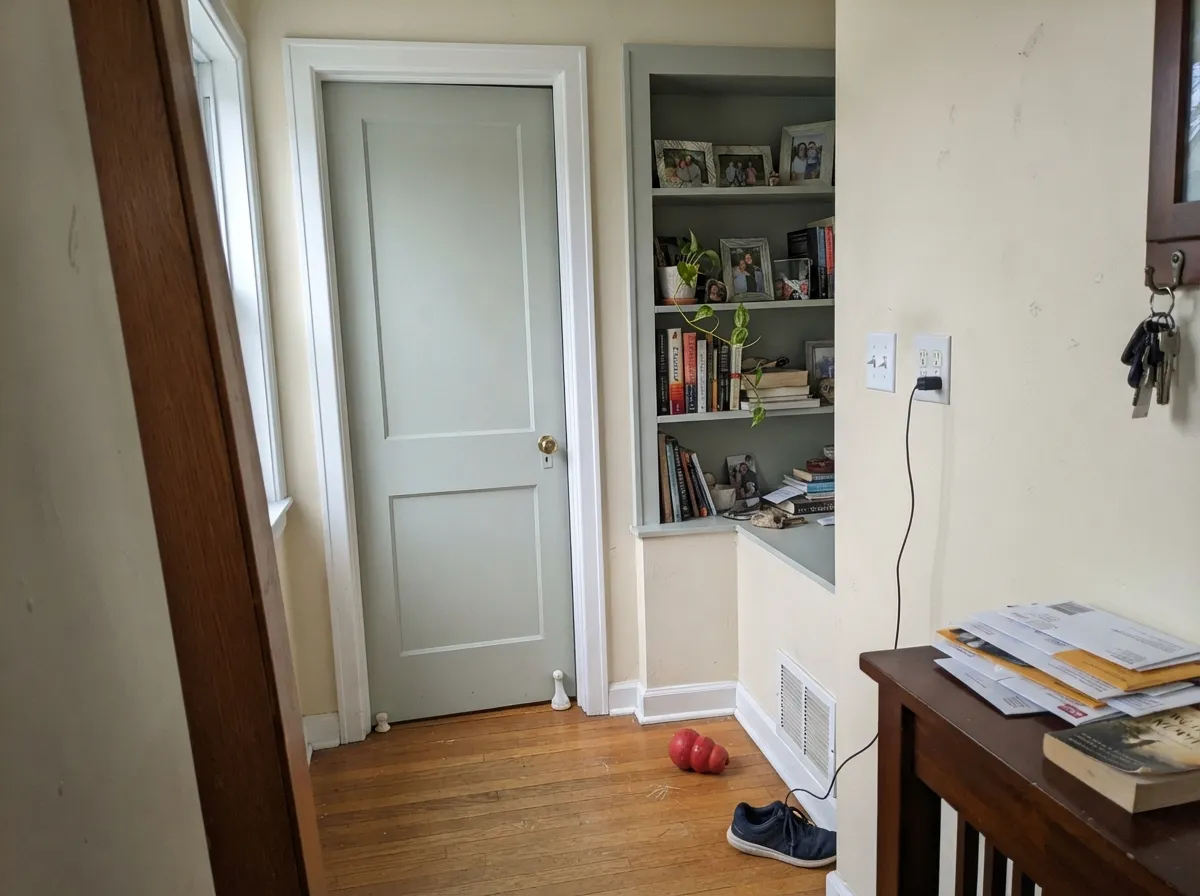 Sea Salt interior door and built-ins with white casing.