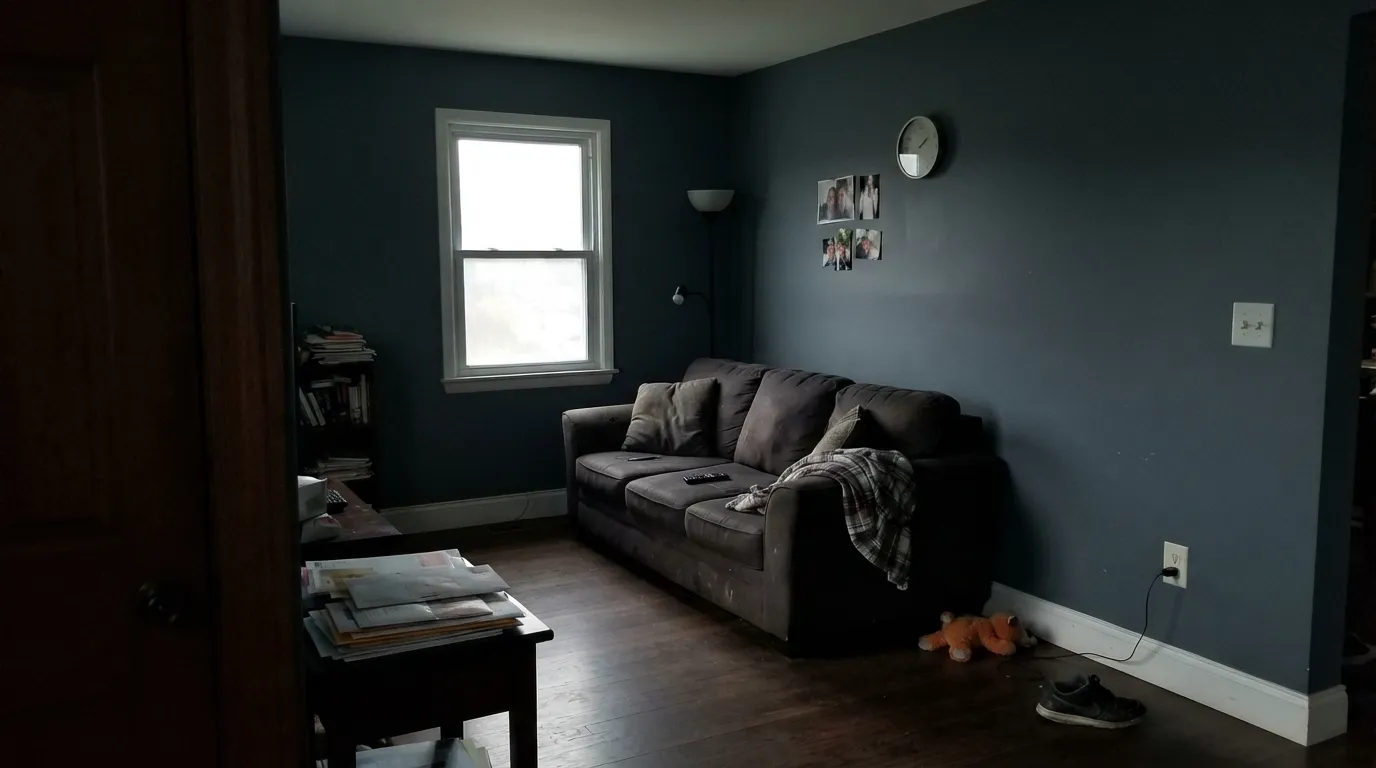 The honest shot: painted on all four walls with no real light, Slate Tile stops reading as blue and just reads as dark — the exact setup behind the "my paint looks black" complaints.