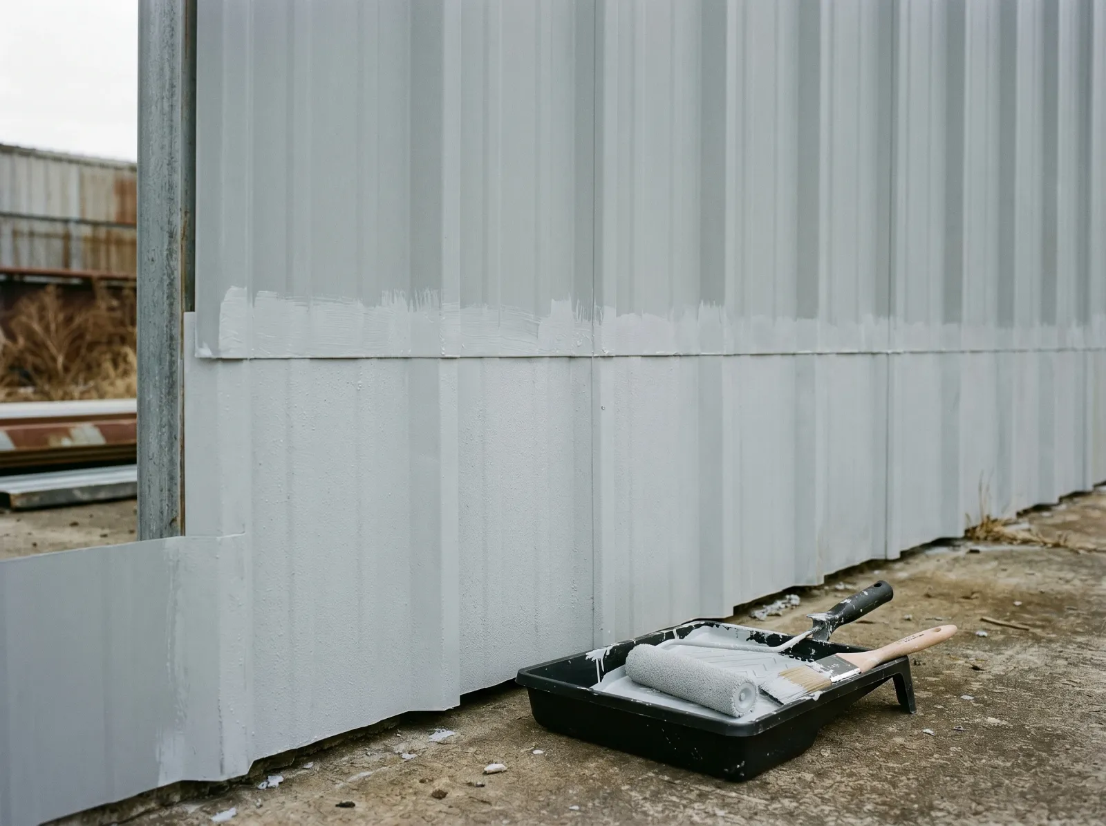Plastisol metal siding after a bonding primer coat with lap edges cut in