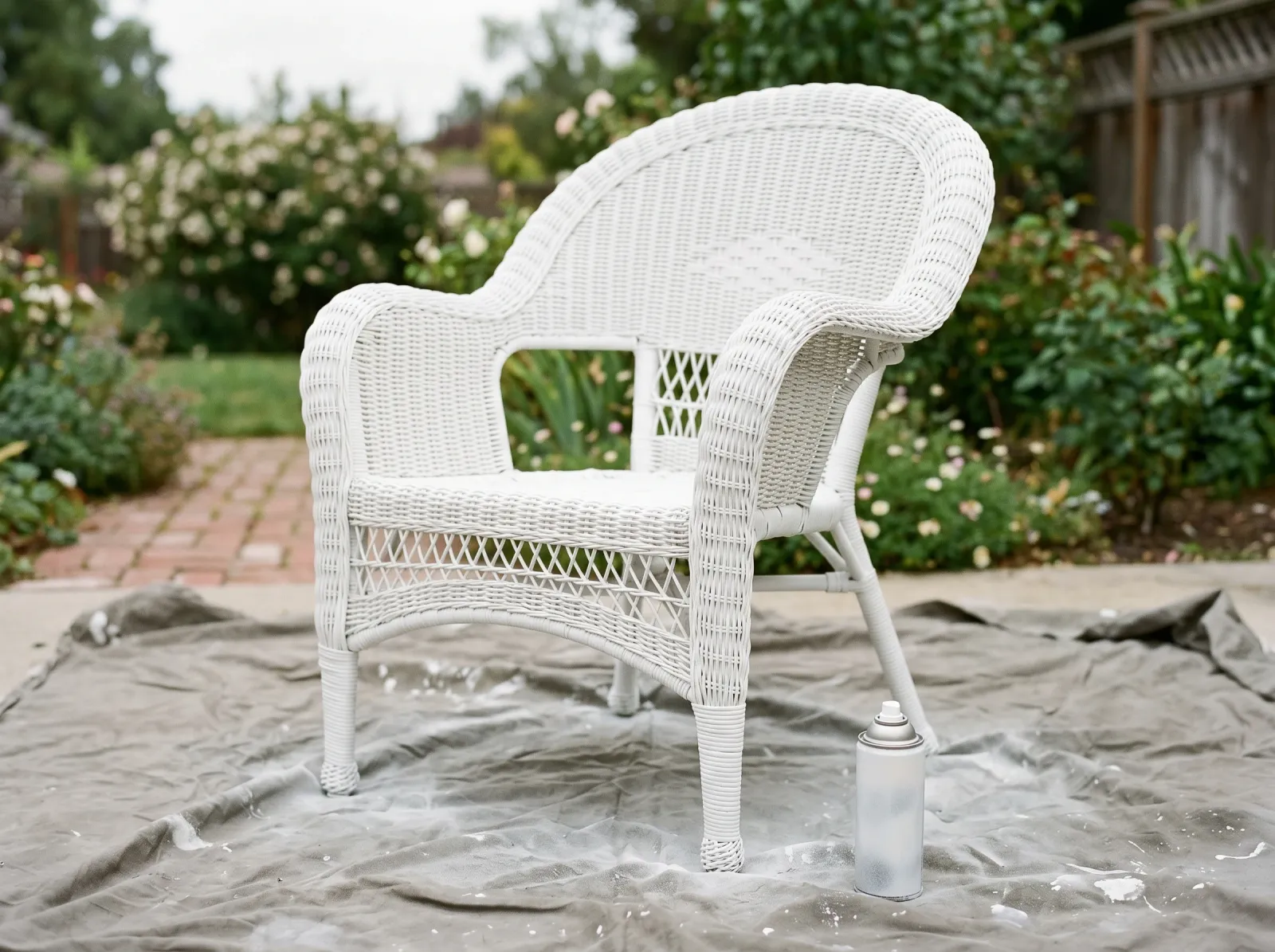 Resin wicker chair after a coat of white plastic-bonding primer