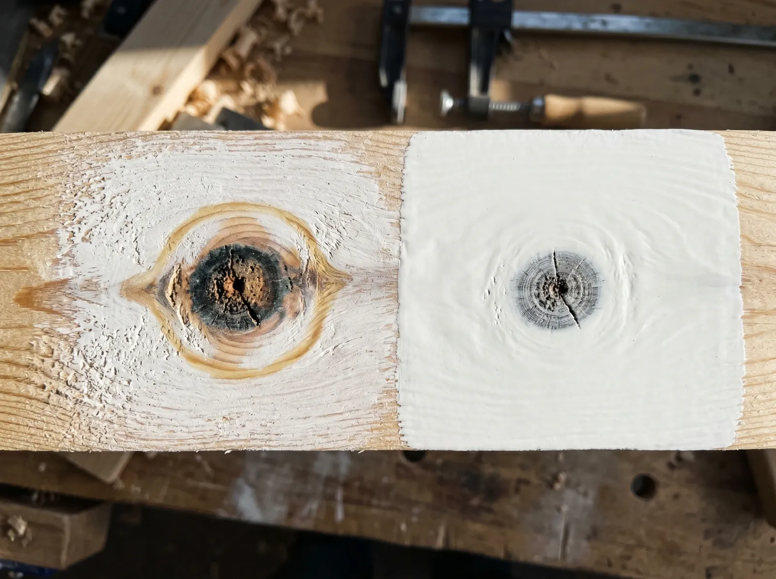 Two primed pine knots compared, one bleeding through water-based primer and one sealed clean under shellac